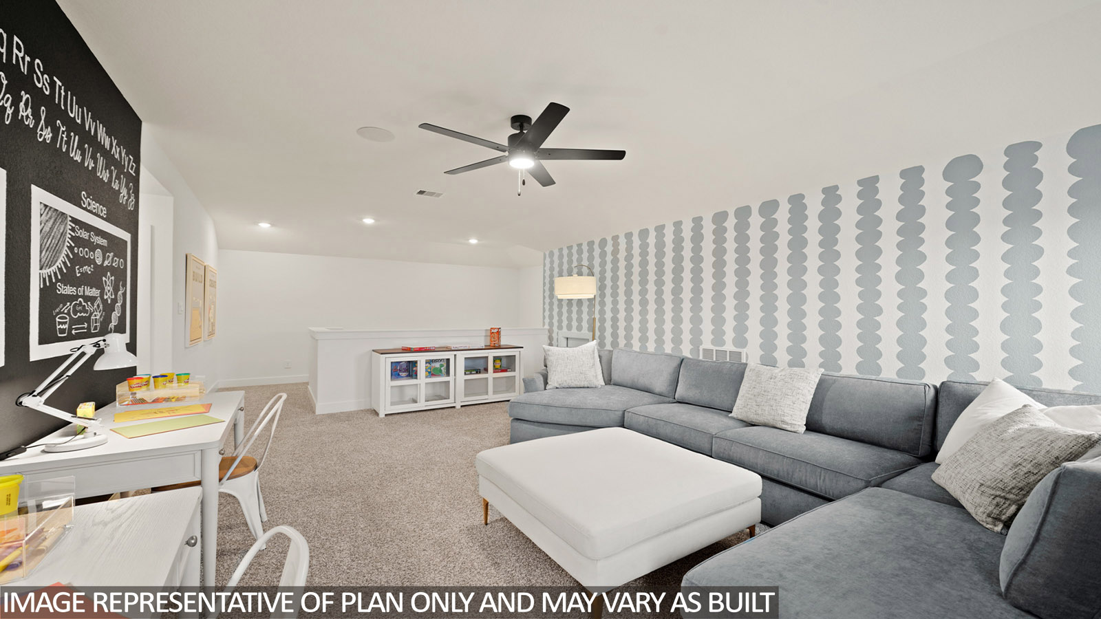 Second story game room with carpet flooring with bright windows in this multi functional space in Katy TX