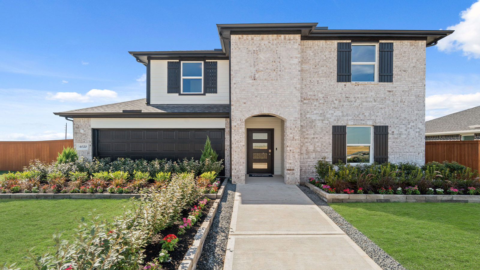 two story house with 2 car garage