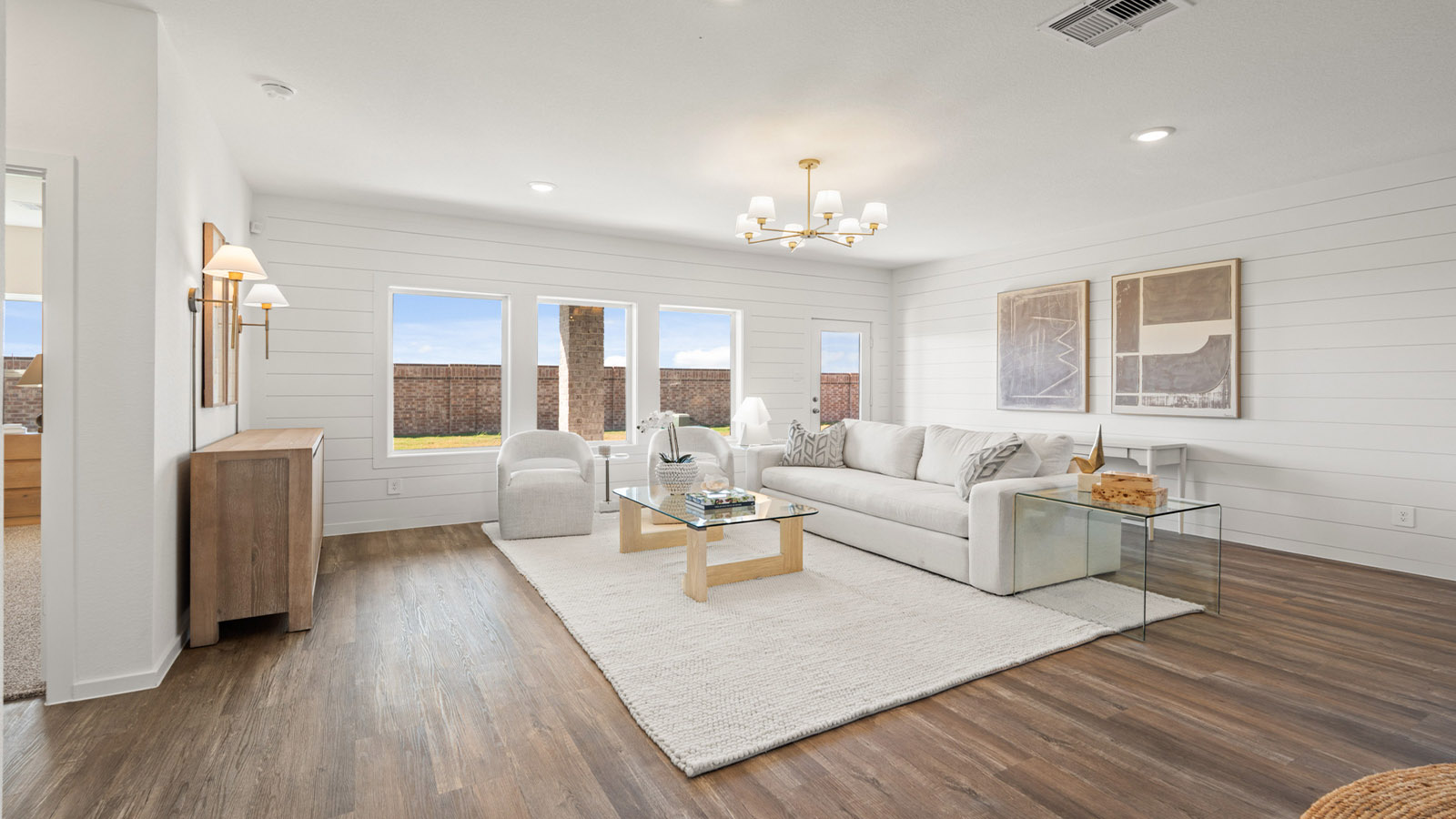 Spacious living area with vinyl flooring