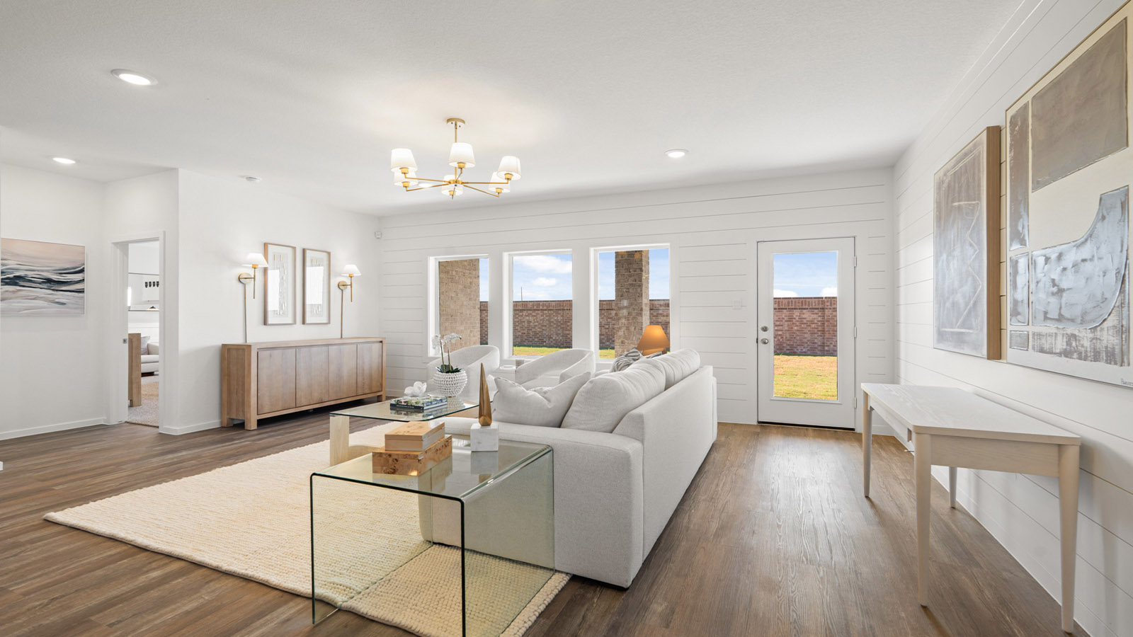 Spacious living area with vinyl flooring