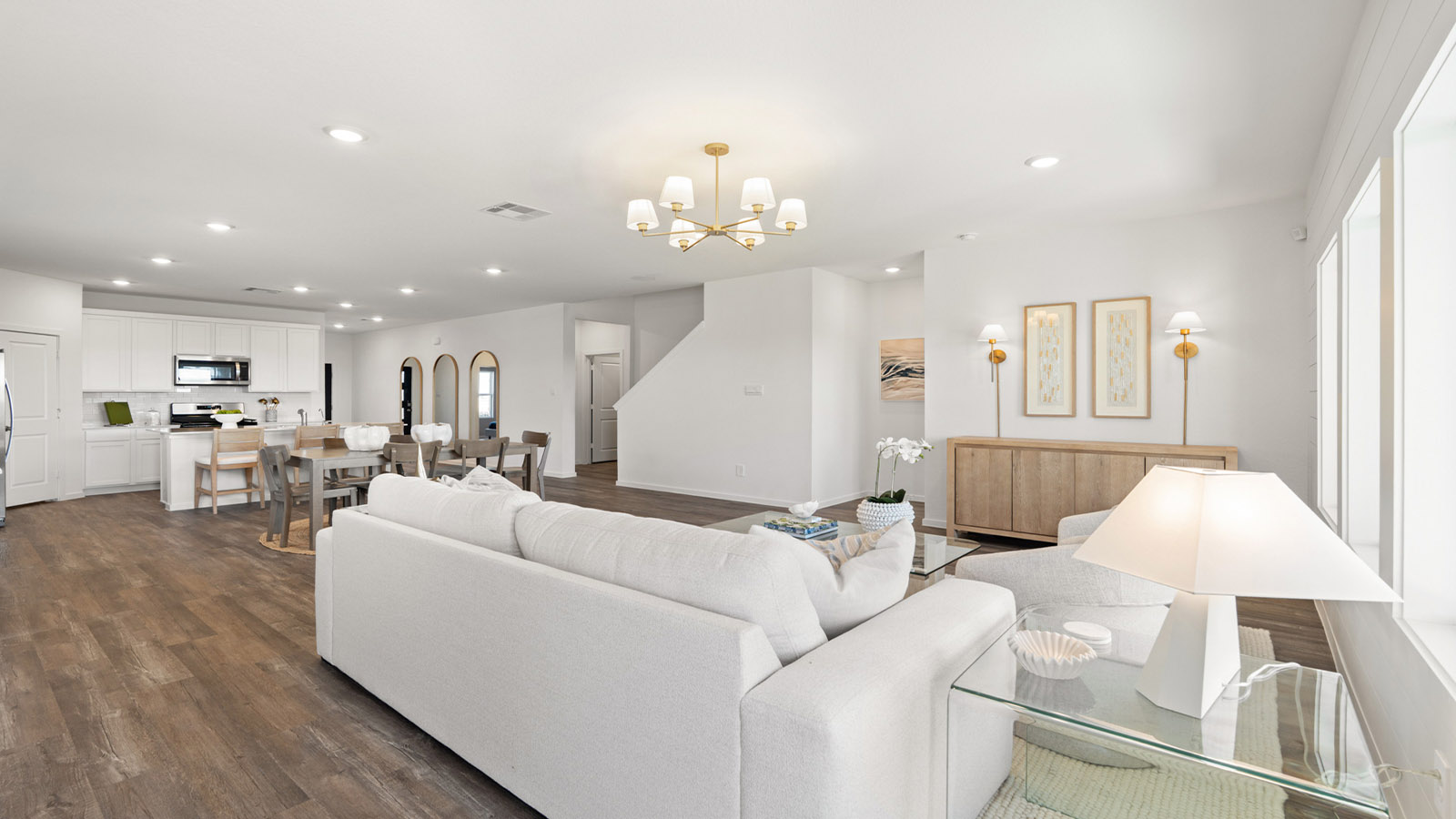 Spacious living area with vinyl flooring