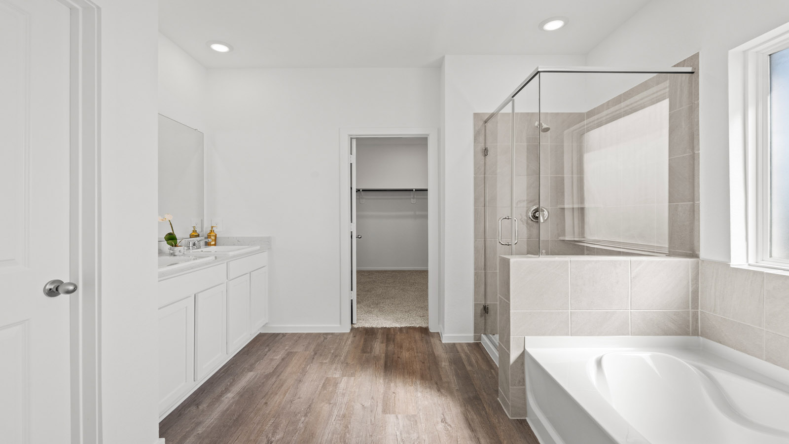 Primary bathroom with tub and shower