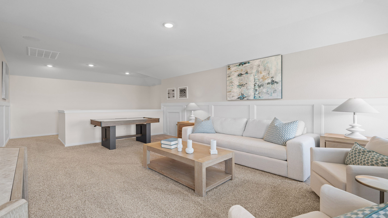 Second story game room with carpet flooring