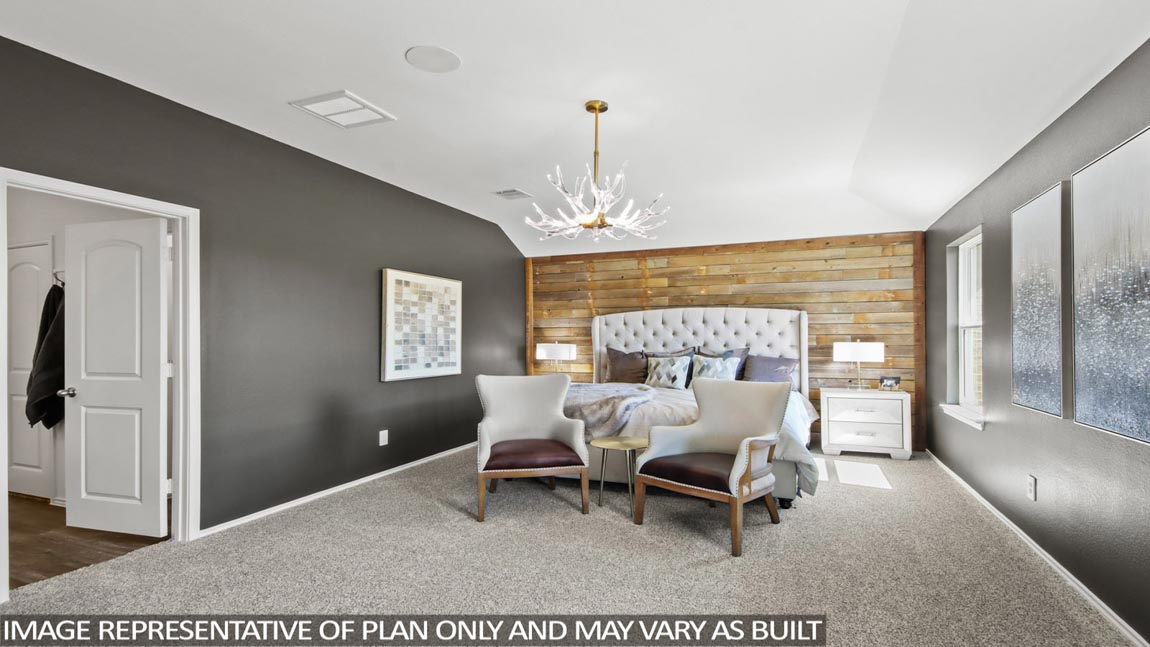 Primary bedroom features ample space, double windows, soft carpet, a stylish walk-in closet, and a private ensuite bath