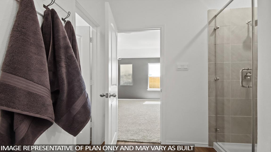 Owner’s ensuite view in our new build home offers function, style, a walk-in closet, spa-like ensuite