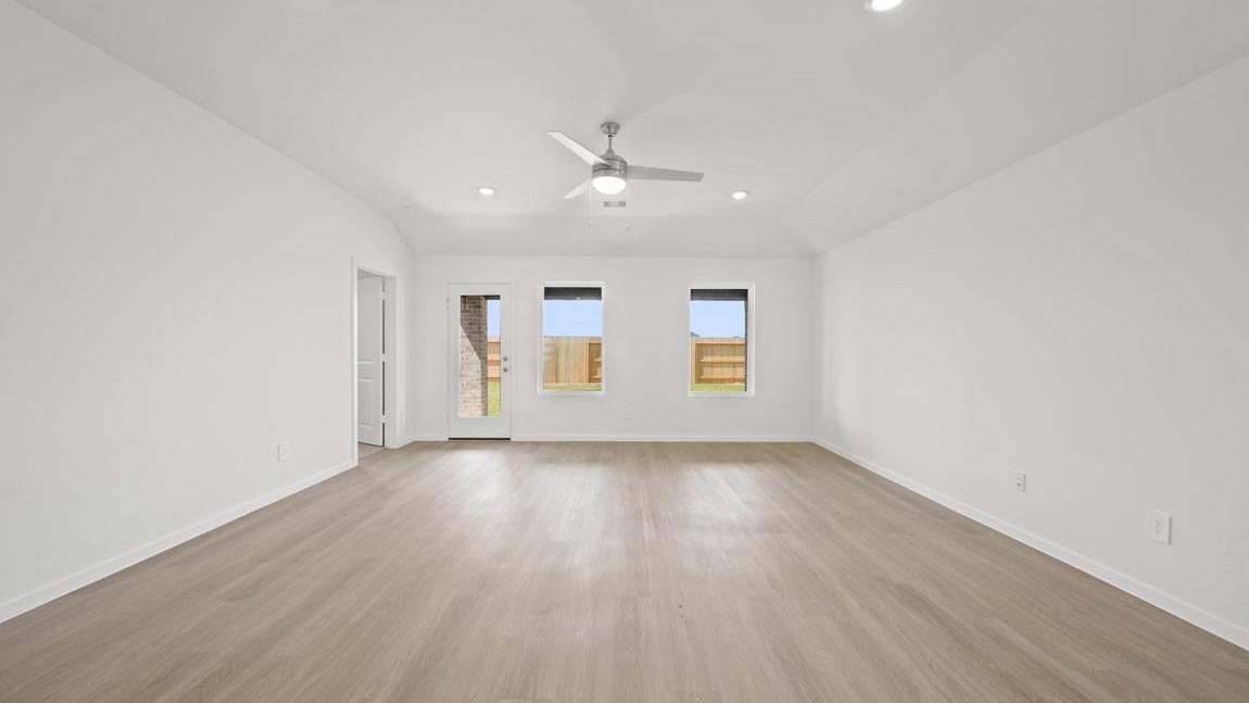 open concept livving and dining area with vinyl flooring and large windows