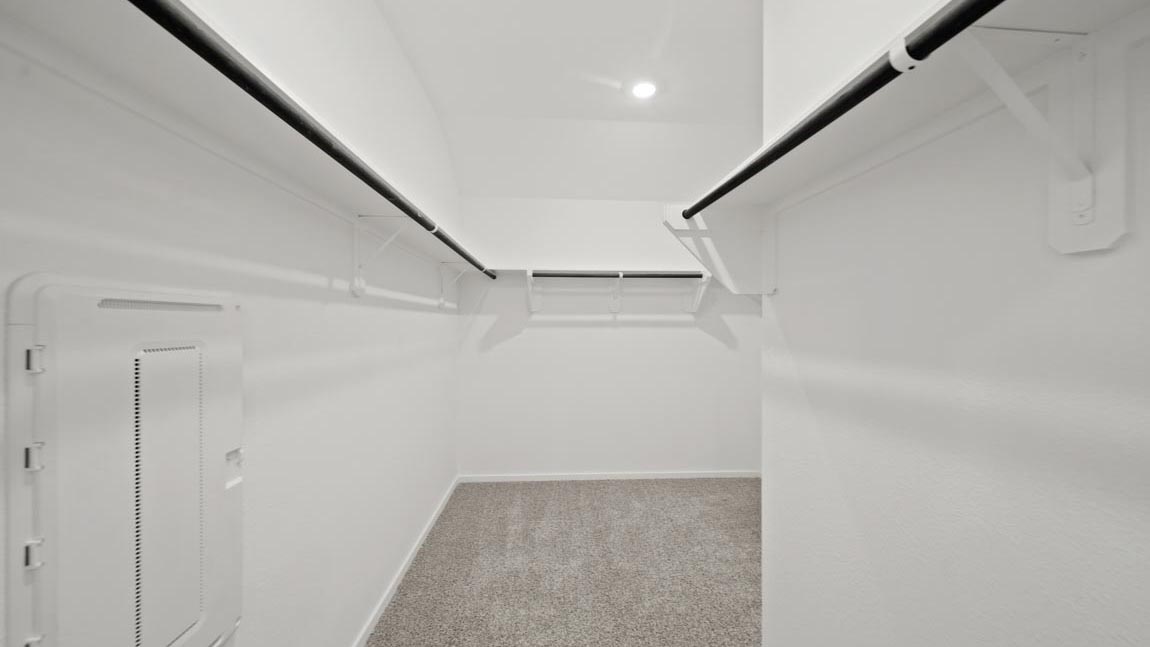 bedroom with carpet flooring and large windows