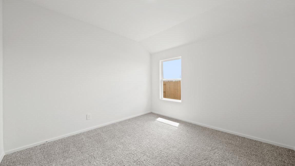 bedroom with carpet flooring and large windows
