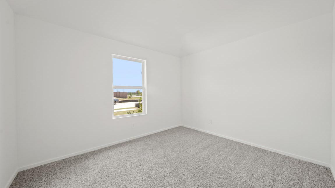 bedroom with carpet flooring and large windows