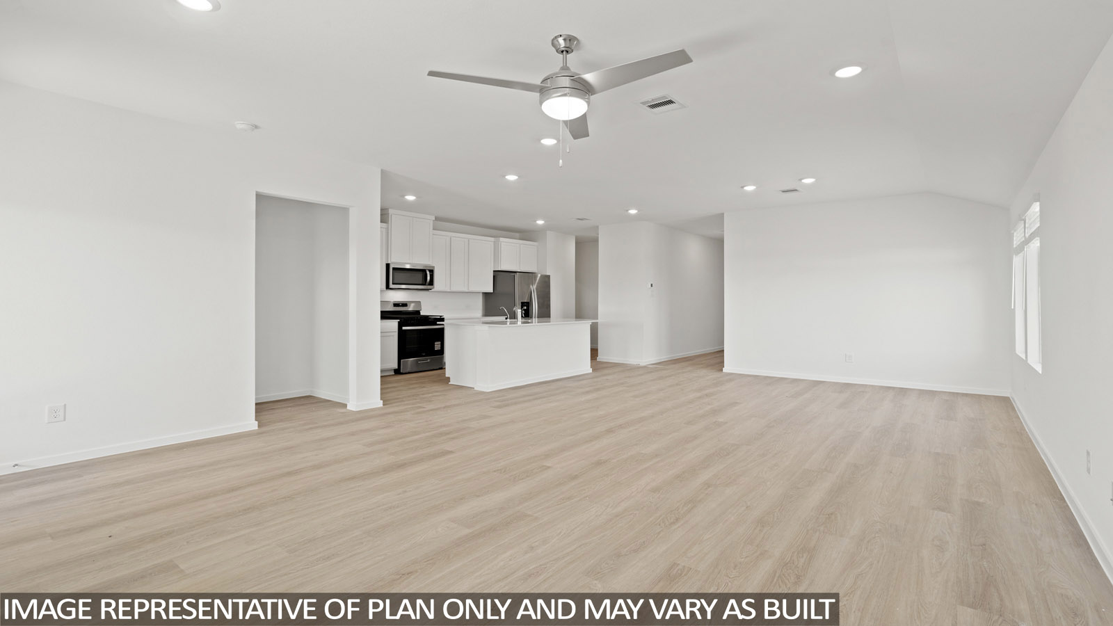 open concept livving and indining area with vinyl flooring, large windows, and quartz countertops