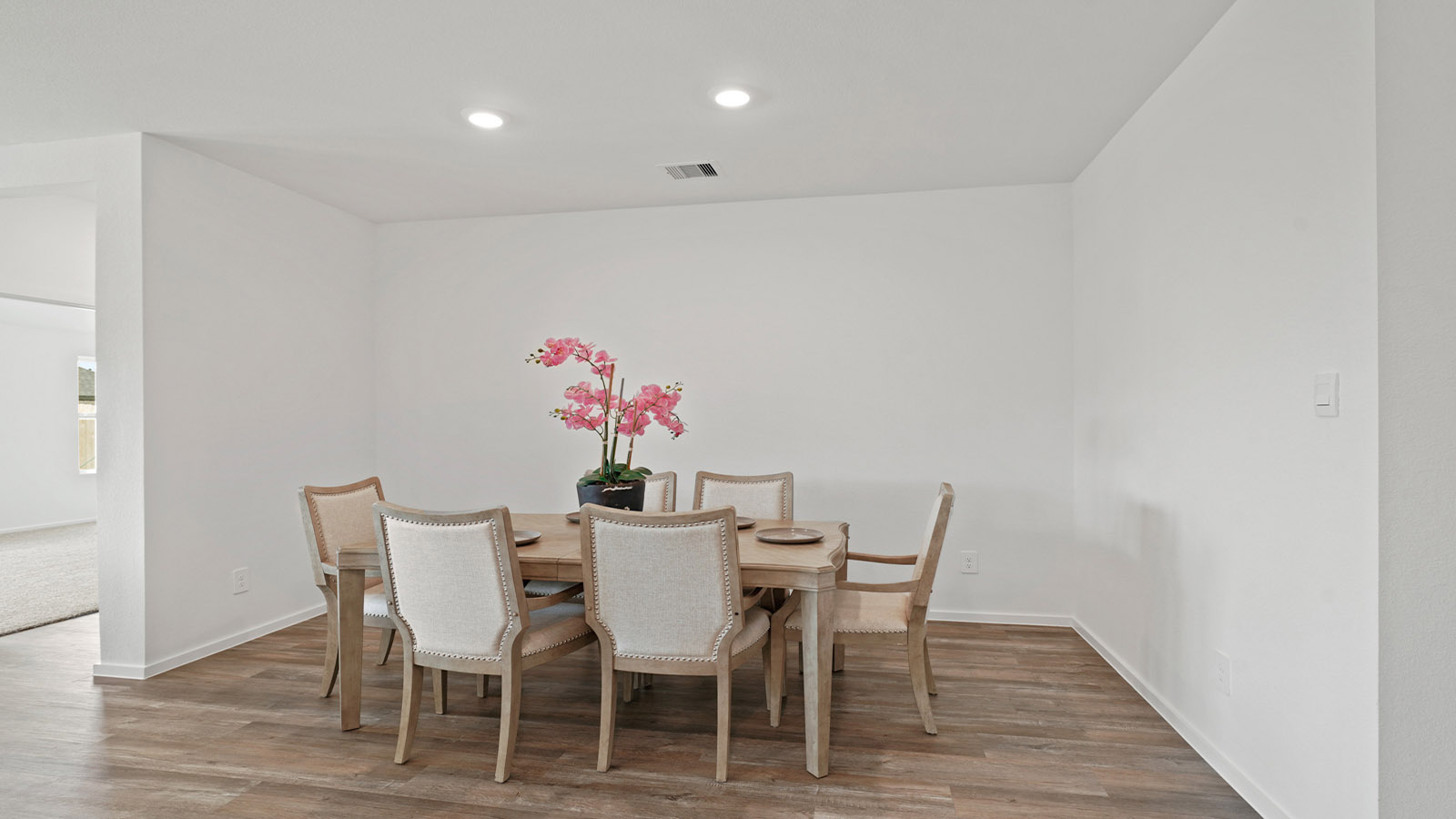open concept living and dining area with vinyl flooring and large windows