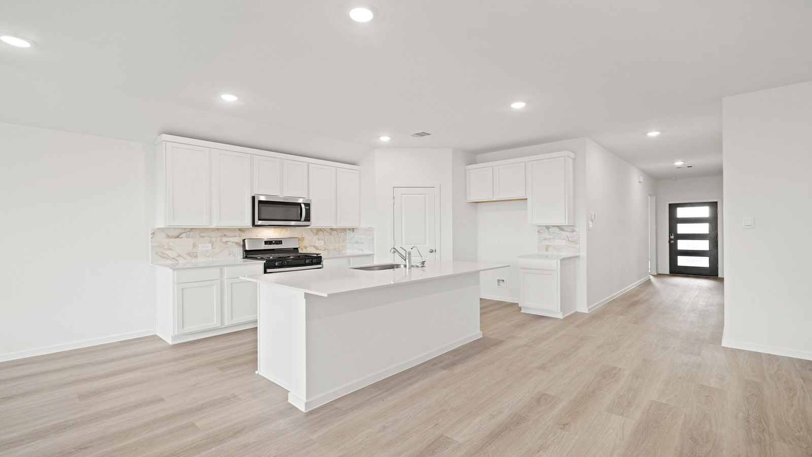 open concept living and dining area with vinyl flooring and large windows