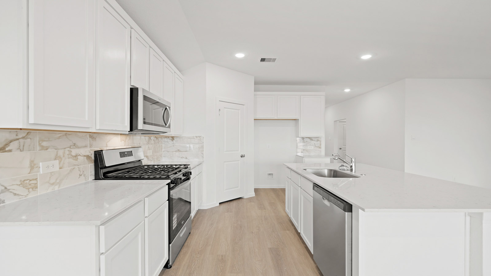 open concept living and dining area with vinyl flooring and large windows