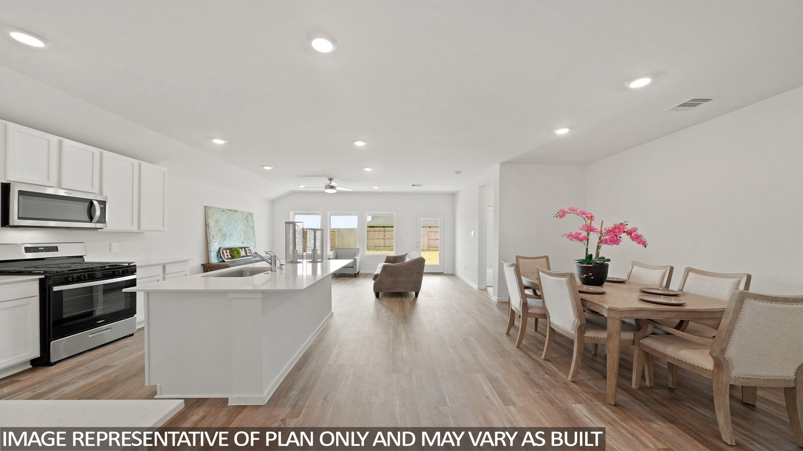 open concept living and dining area with vinyl flooring