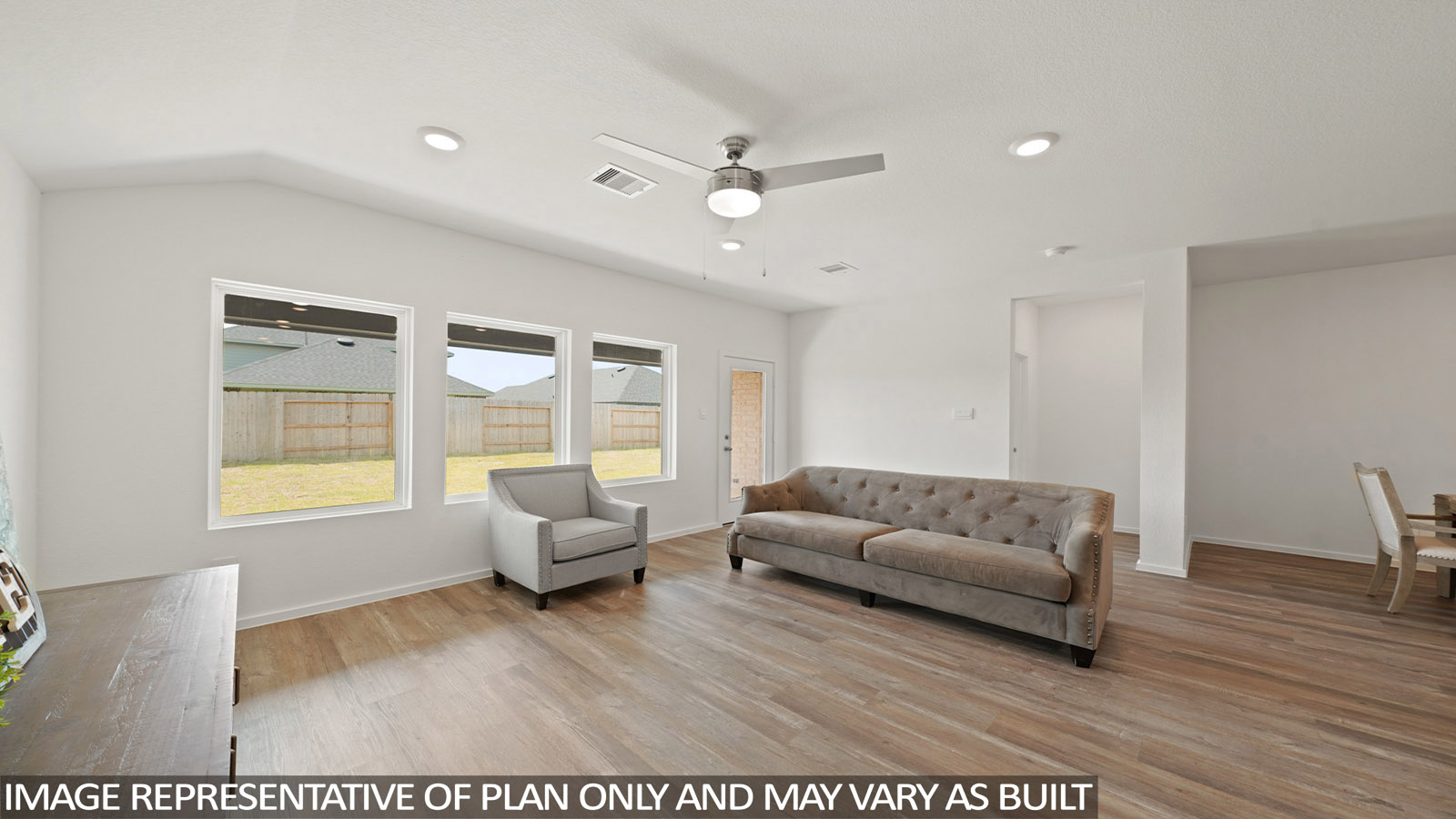 open concept living and dining area with vinyl flooring