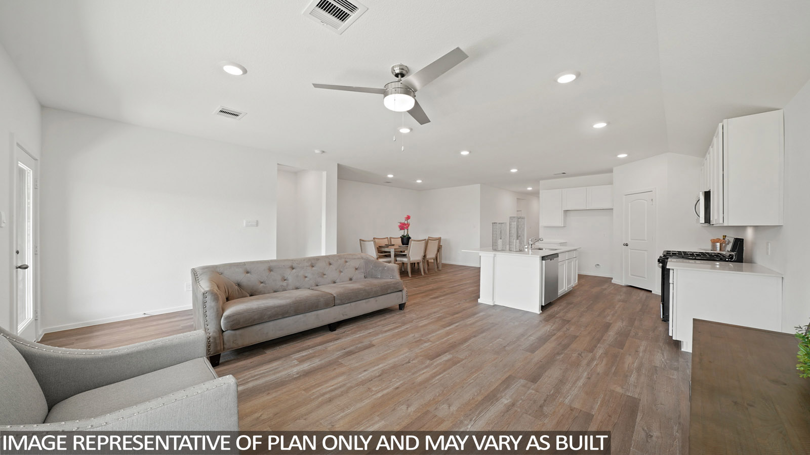 open concept living and dining area with vinyl flooring