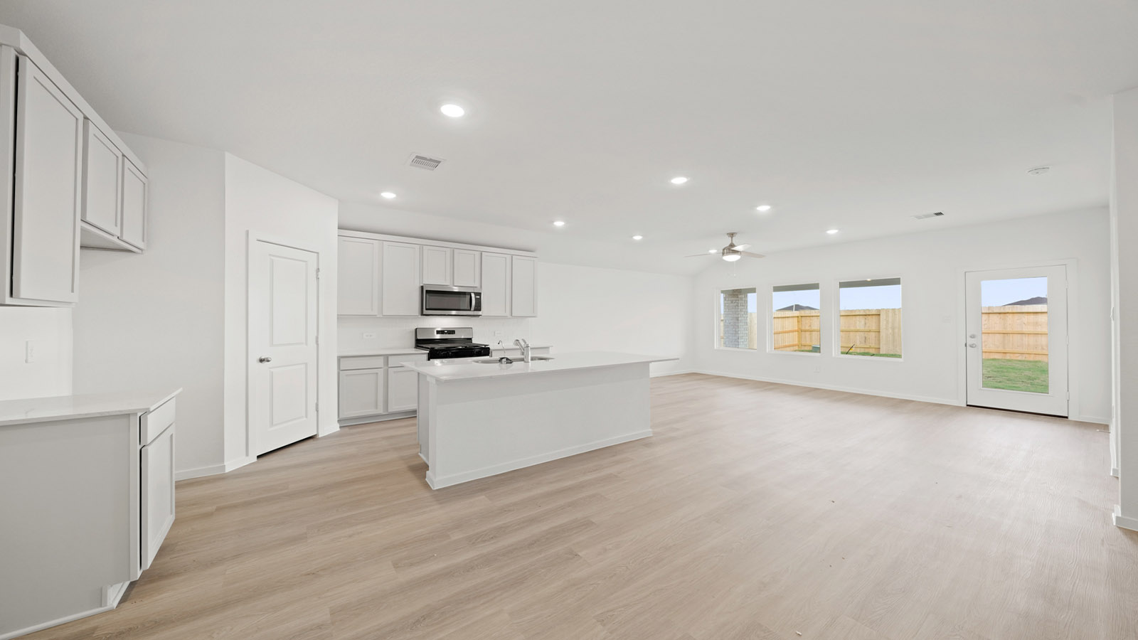 open concept living and dining area with vinyl flooring