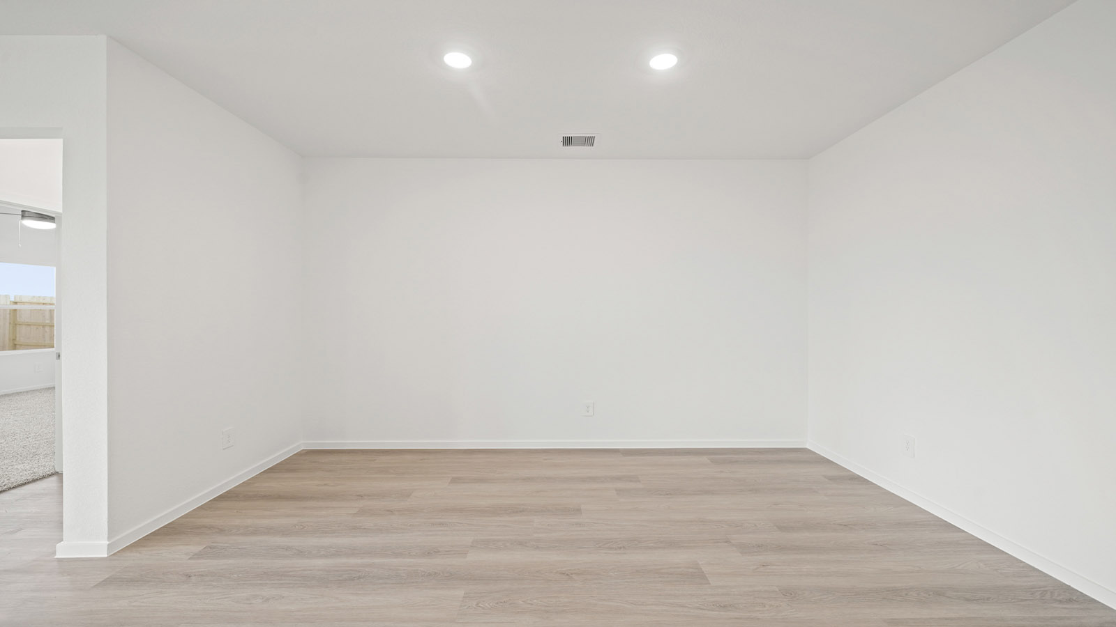 open concept living and dining area with vinyl flooring