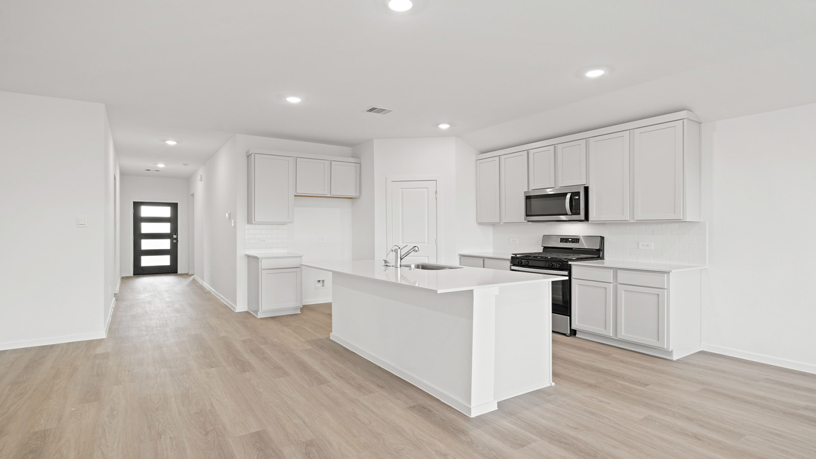 open concept living and dining area with vinyl flooring