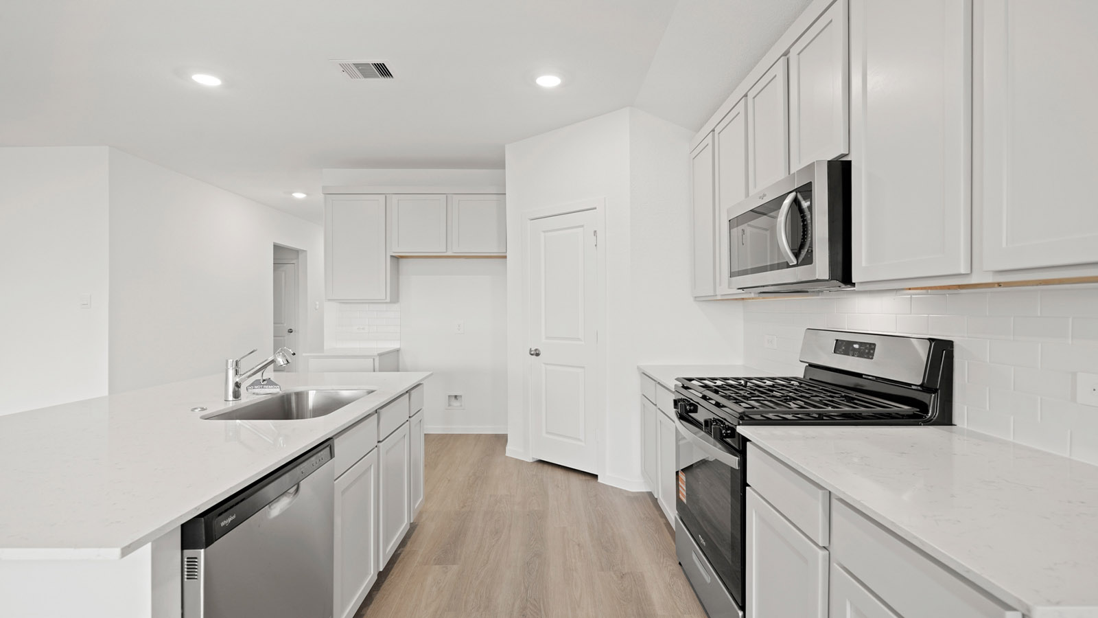 open concept living and dining area with vinyl flooring