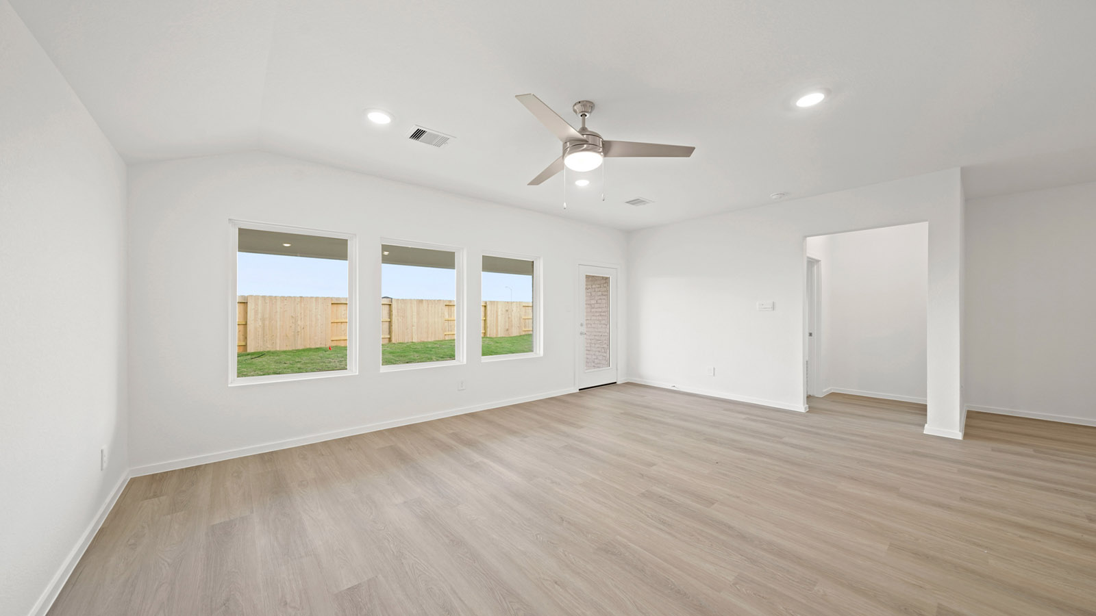 open concept living and dining area with vinyl flooring