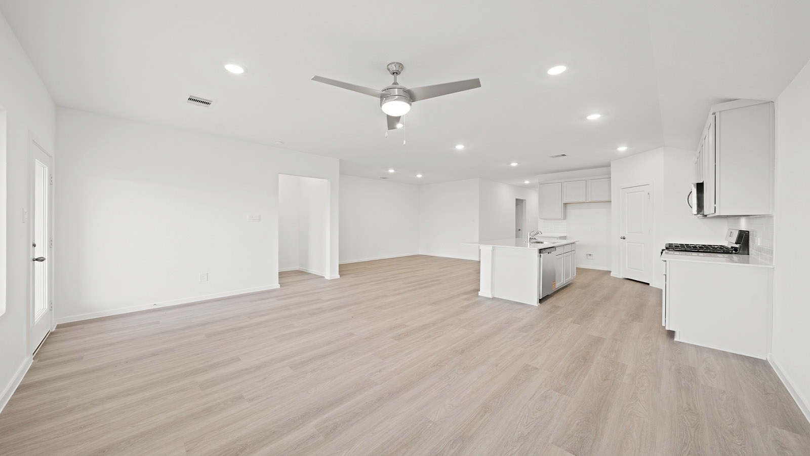 open concept living and dining area with vinyl flooring