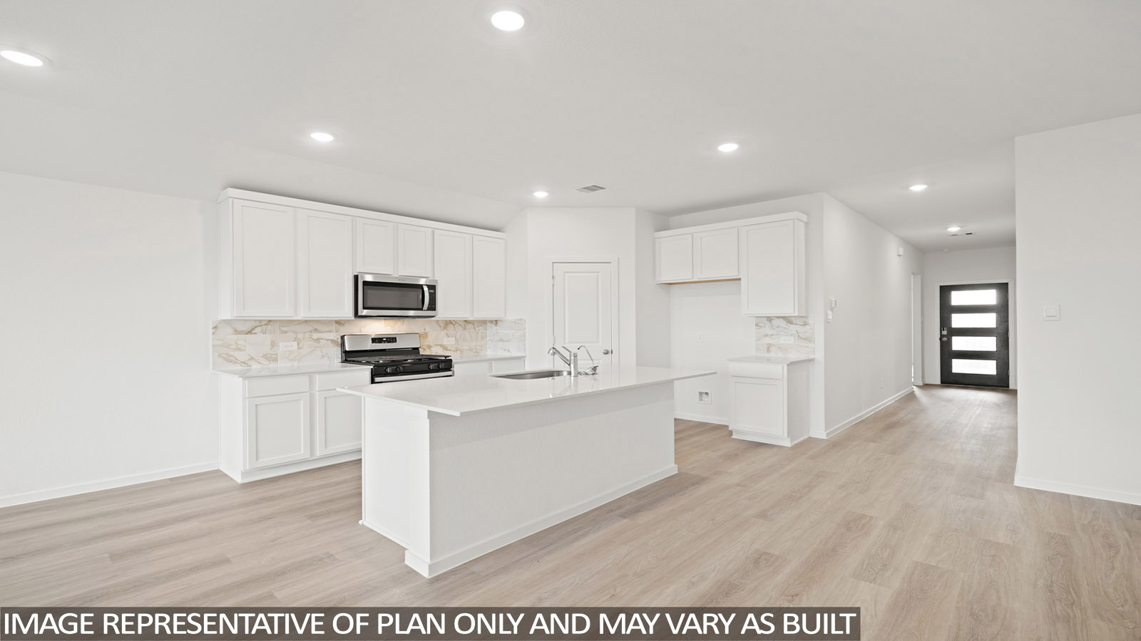kitchen with backsplash, quartz countertops, and stainless steel appliances