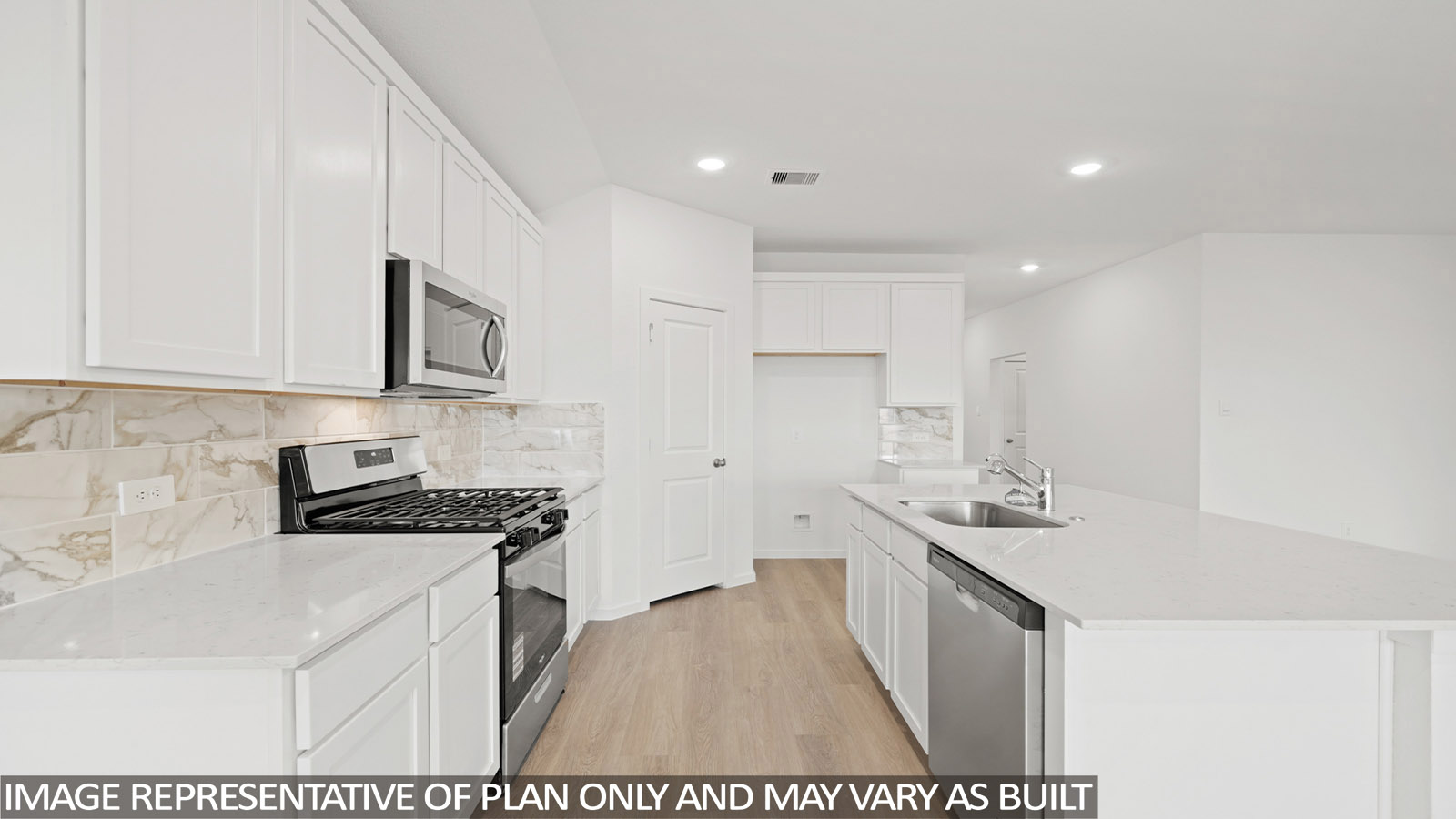 kitchen with backsplash, quartz countertops, and stainless steel appliances