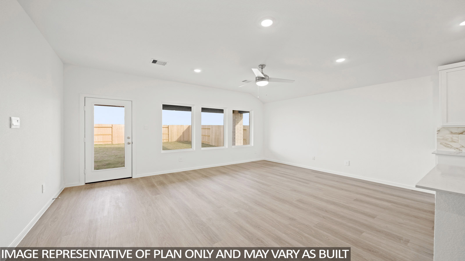 open concept living and dining area with vinyl flooring and large windows