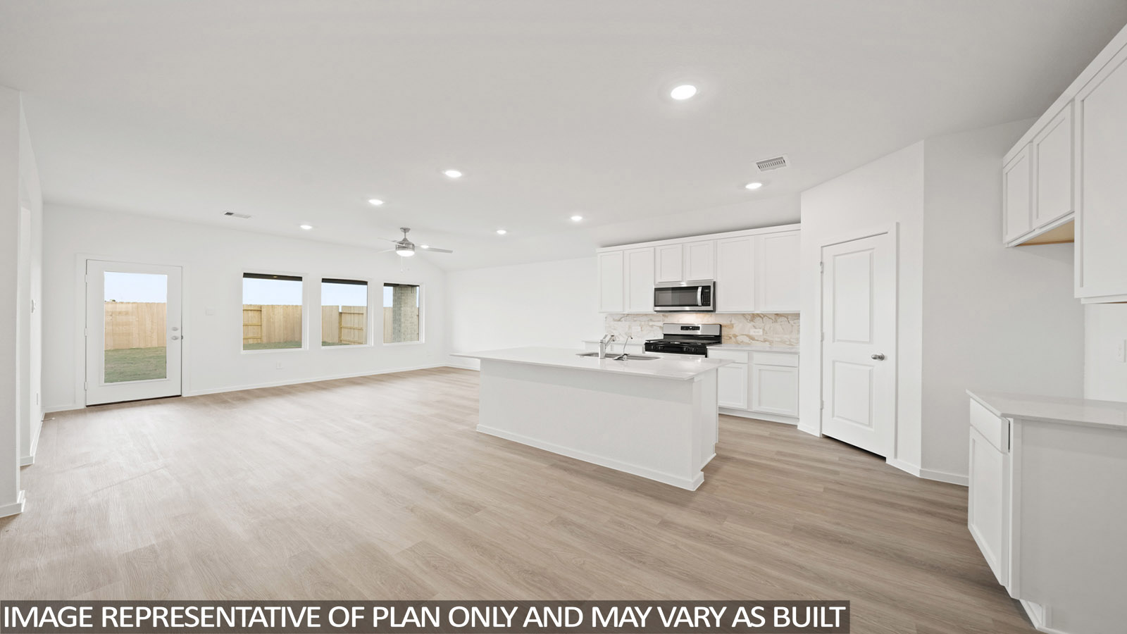 kitchen with backsplash, quartz countertops, and stainless steel appliances