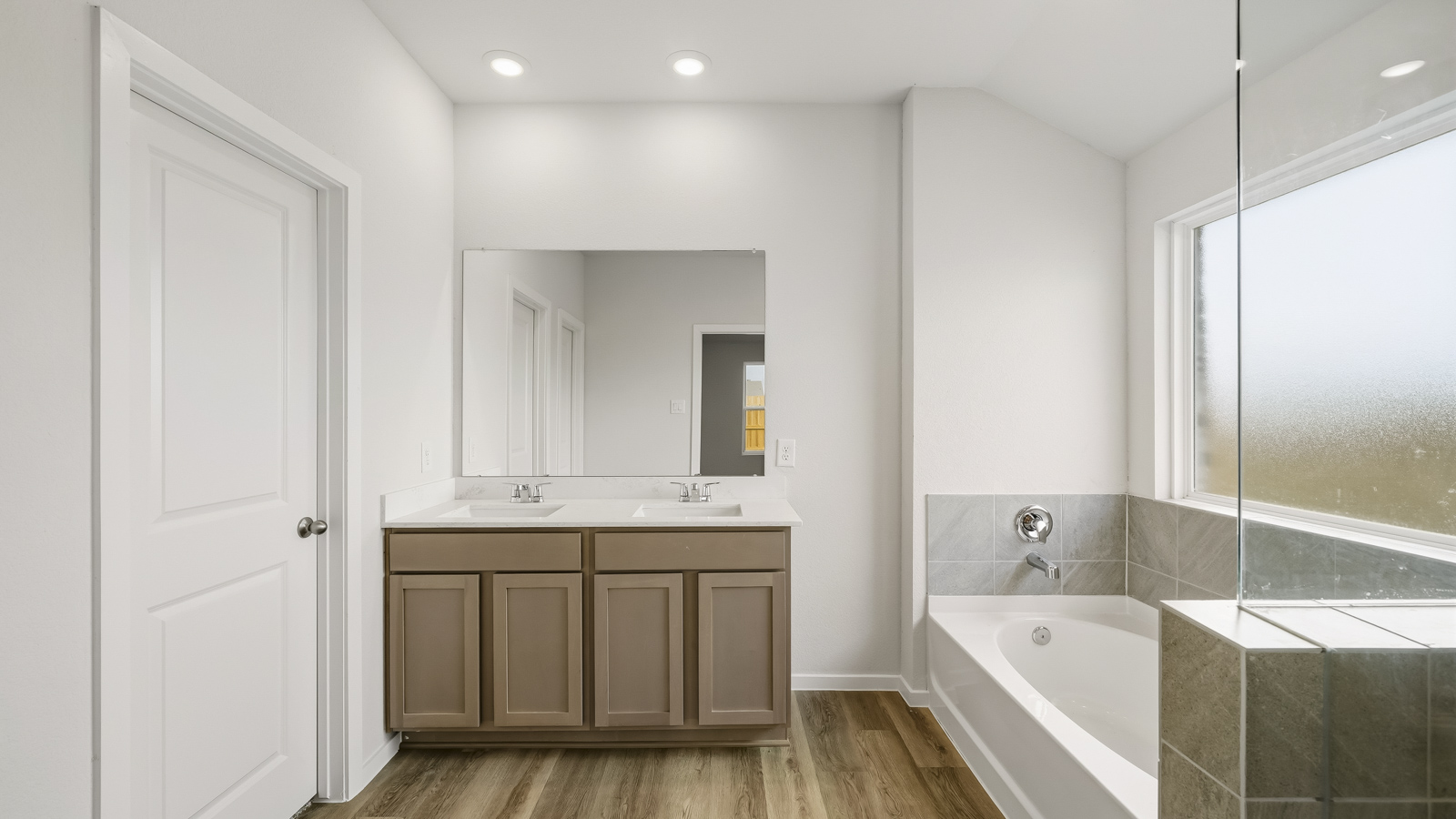 Primary bathroom with double sinks with quartz counter tops in Katy TX
