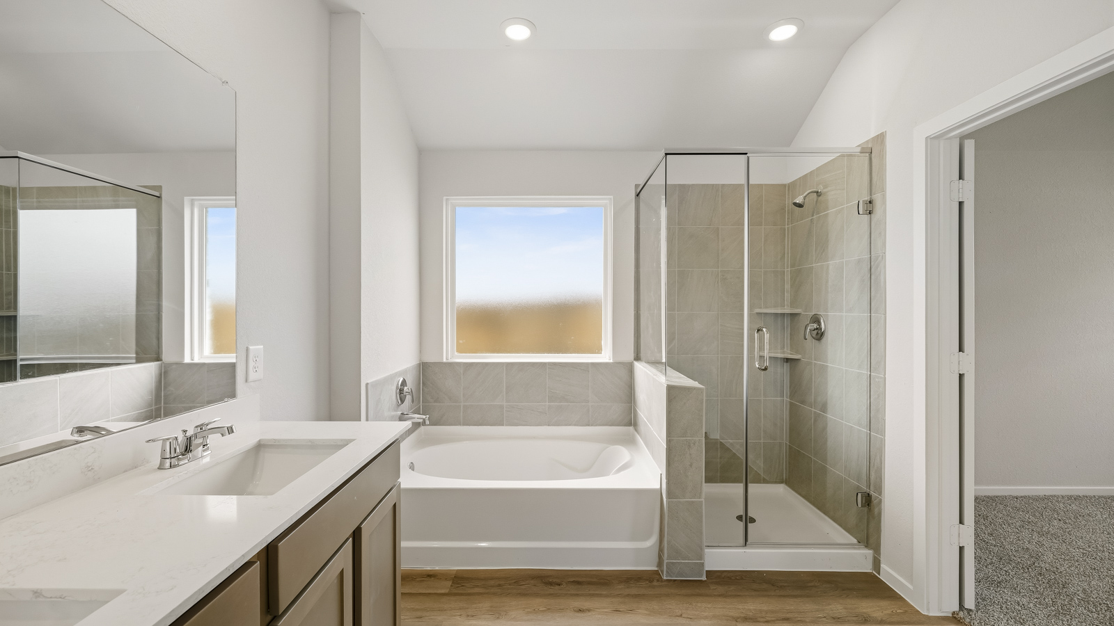 Primary bathroom with double sinks with quartz counter tops in Katy TX