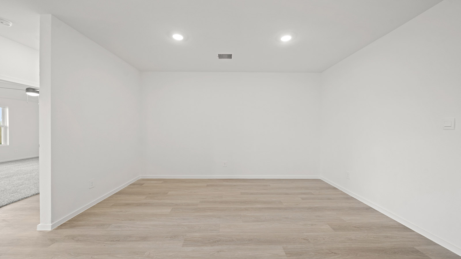 open concept living and dining area with vinyl flooring
