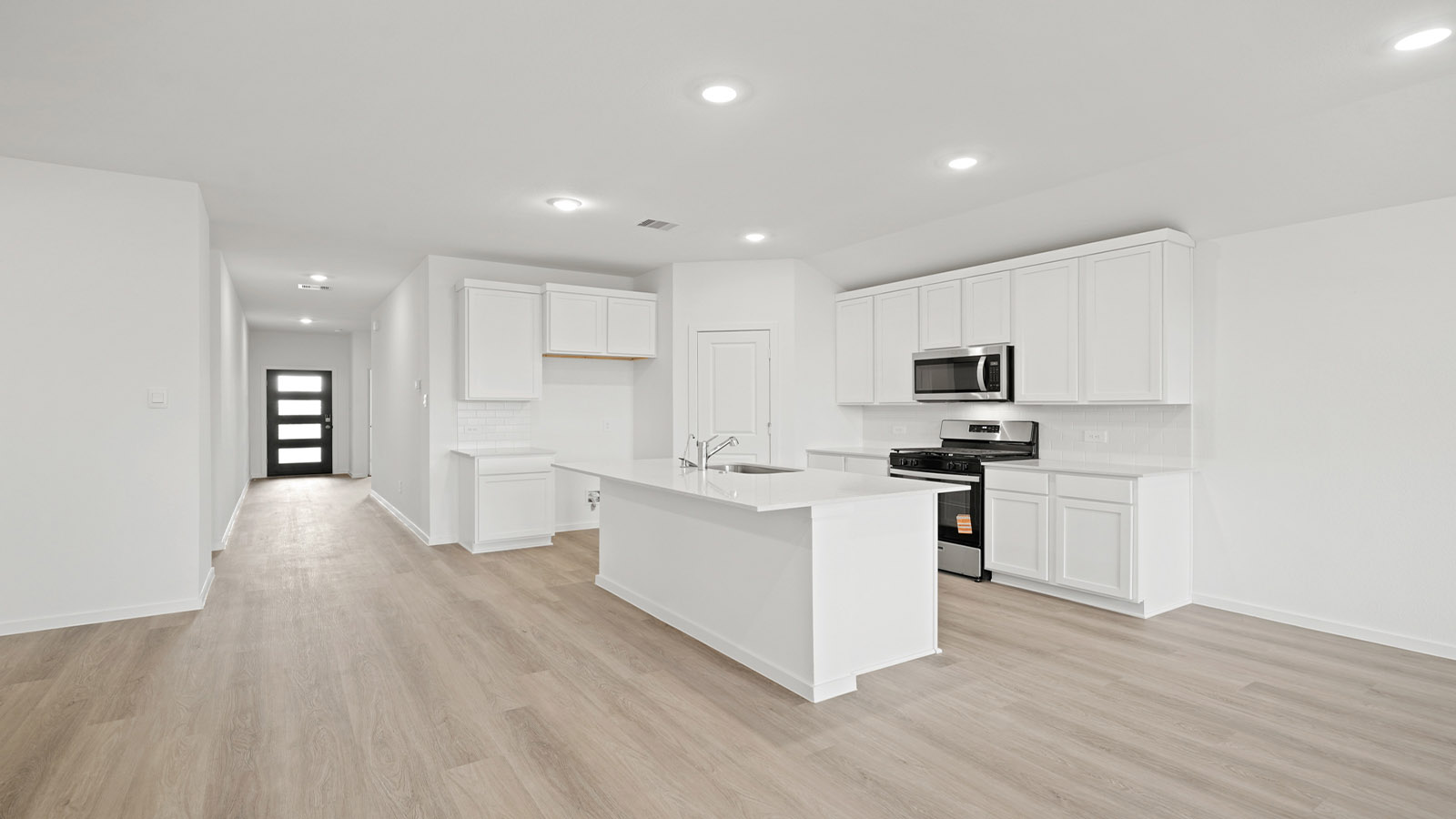 open concept living and dining area with vinyl flooring