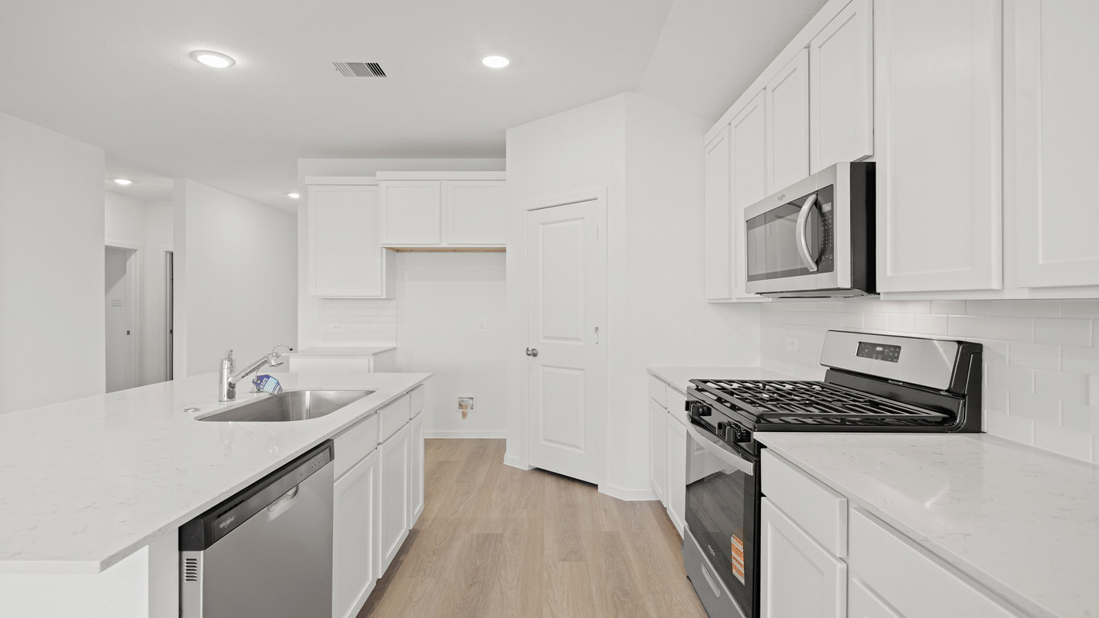 open concept living and dining area with vinyl flooring