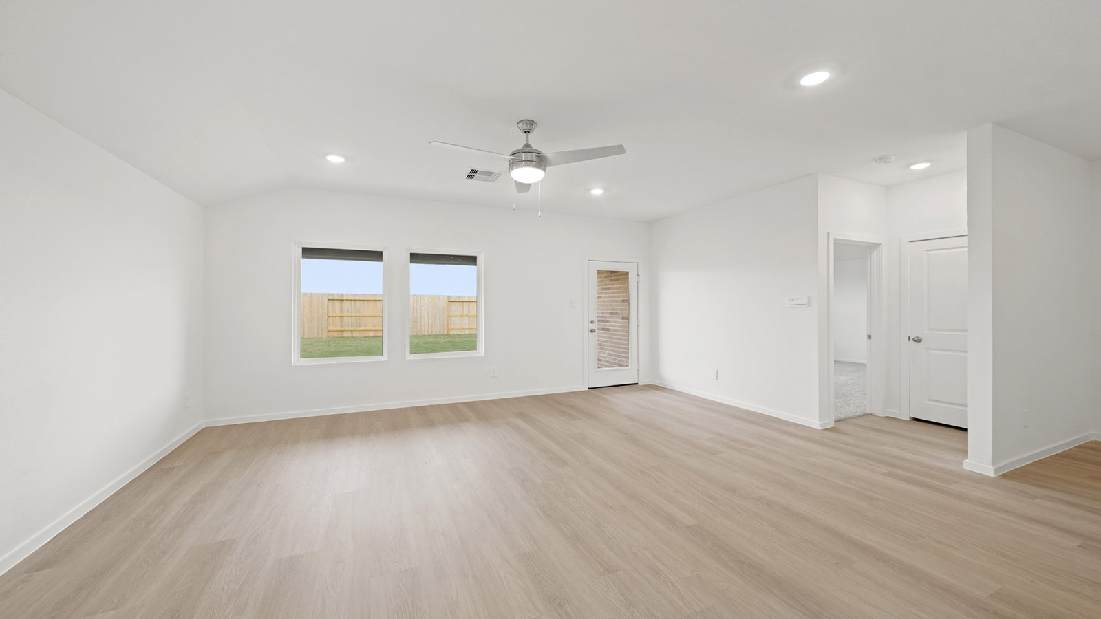open concept living and dining area with vinyl flooring
