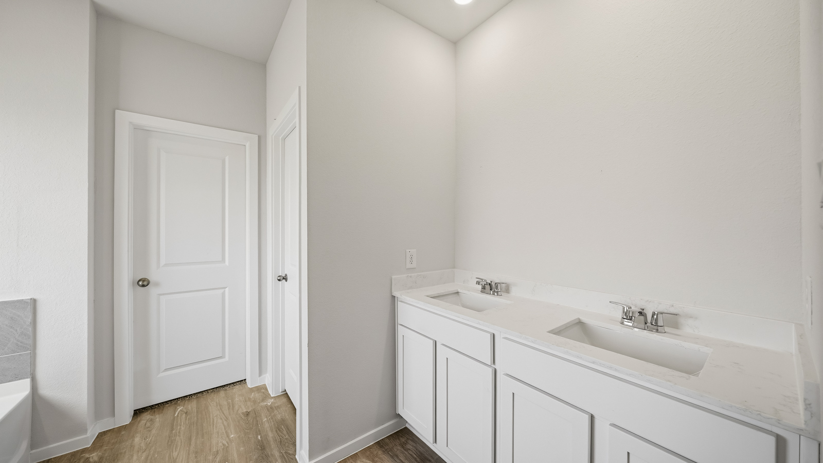 primary bathroom with separate tub and shower