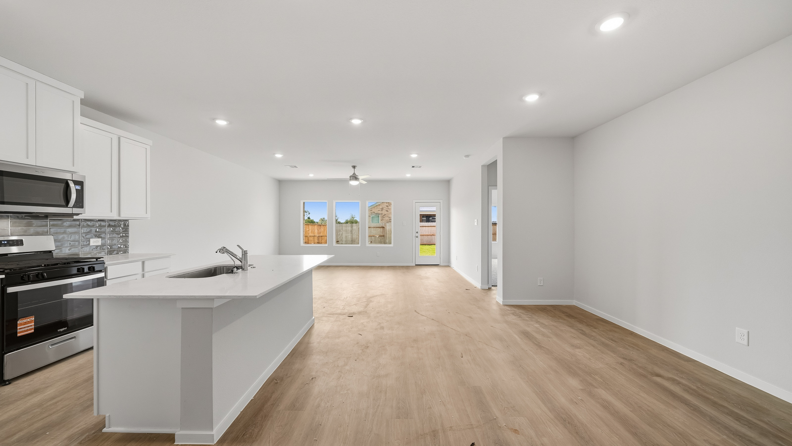 kitchen with backsplash and quartz countertops