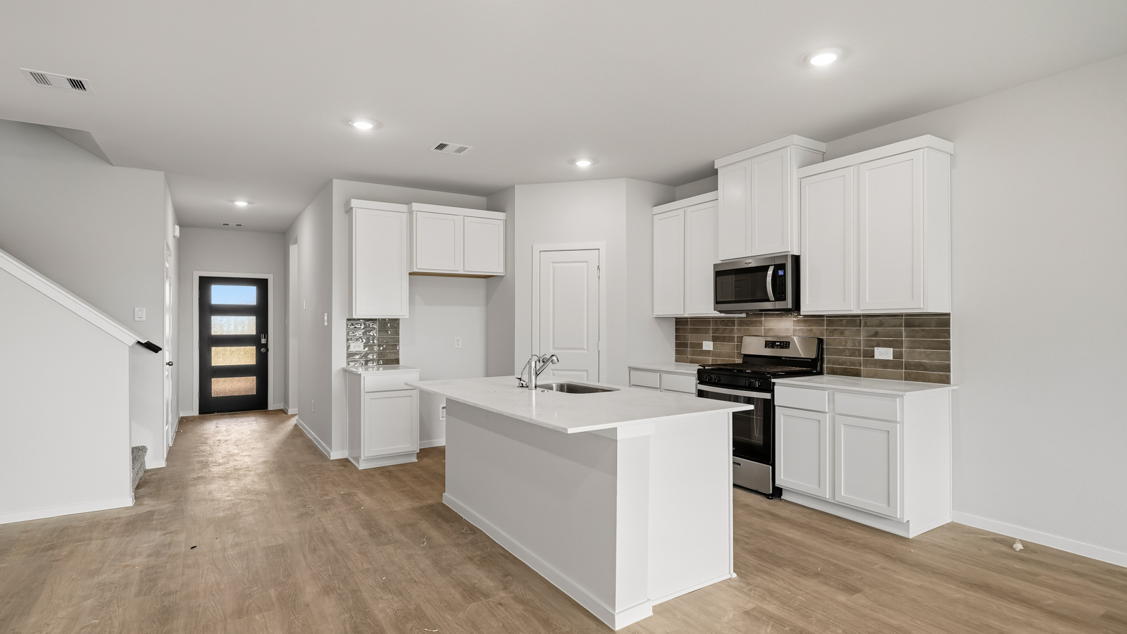 kitchen with backsplash and quartz countertops