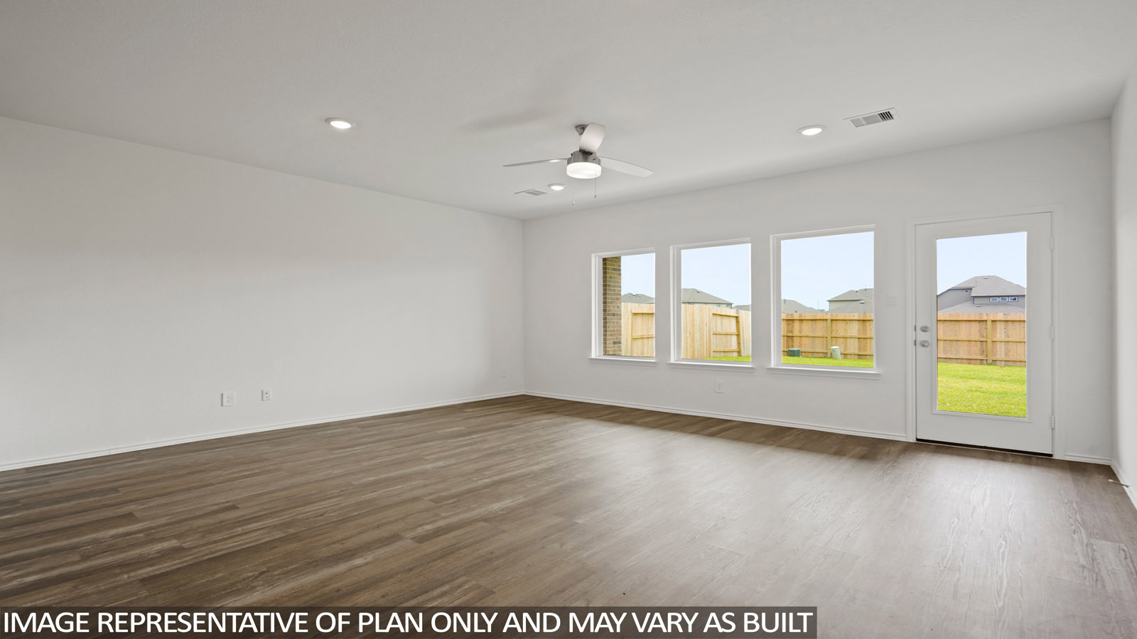 living room with vinyl flooring and large windows