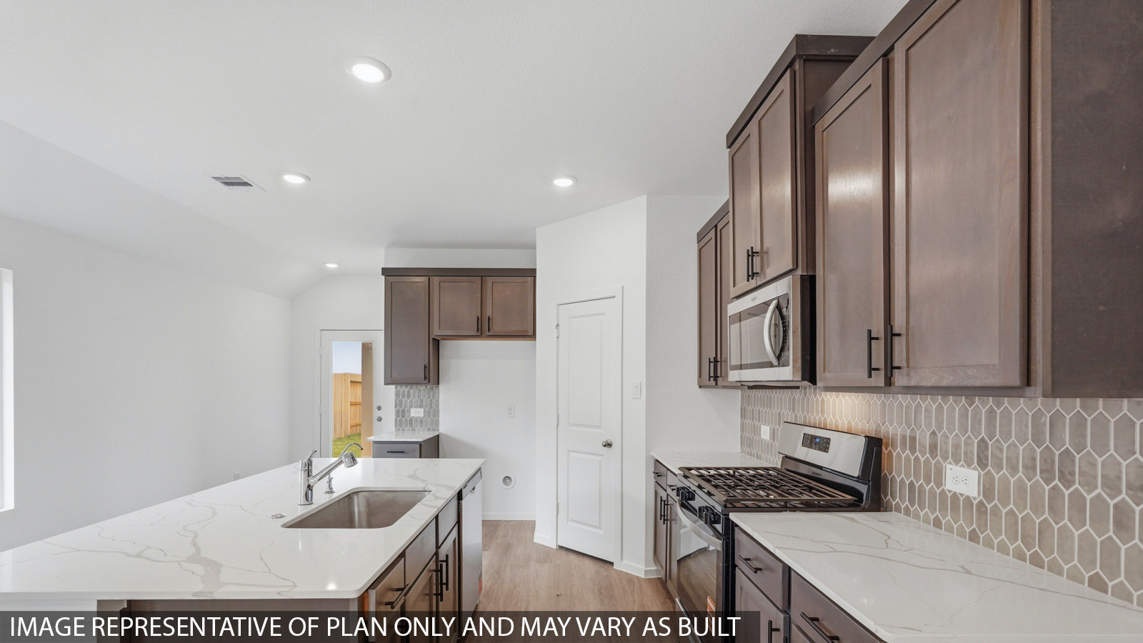 kitchen with quartz countertops and stainless steel appliances