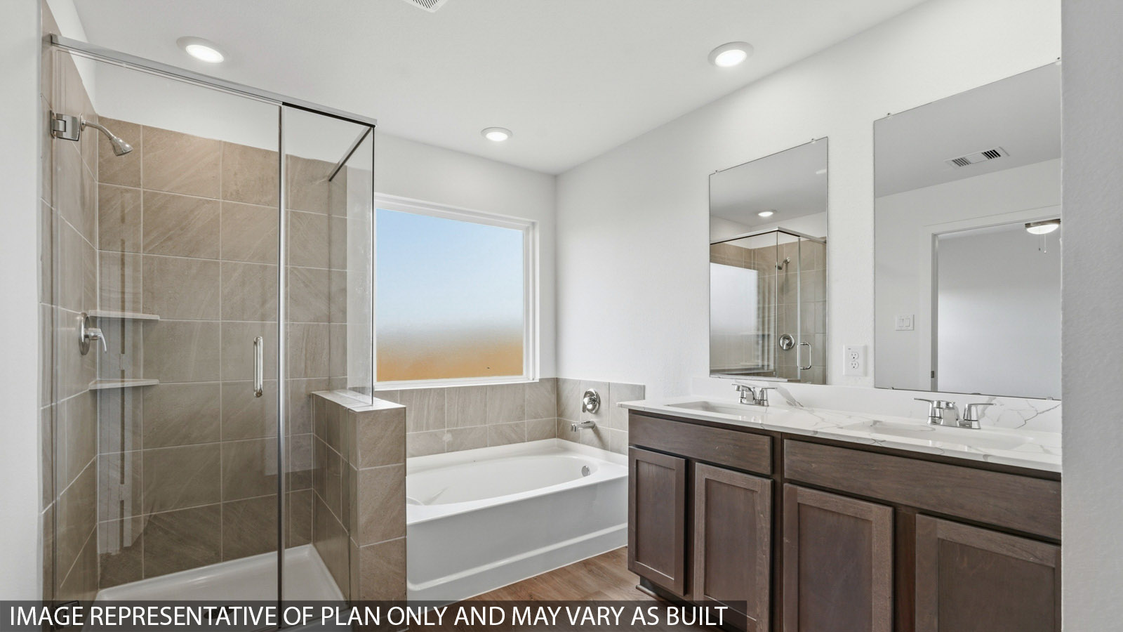 primary bathroom with separate tub and bathroom