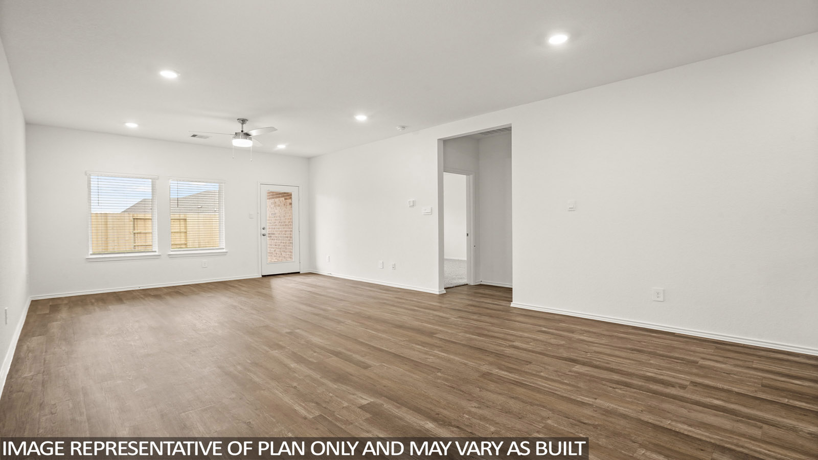 open concept living and dining area with vinyl flooring and large windows