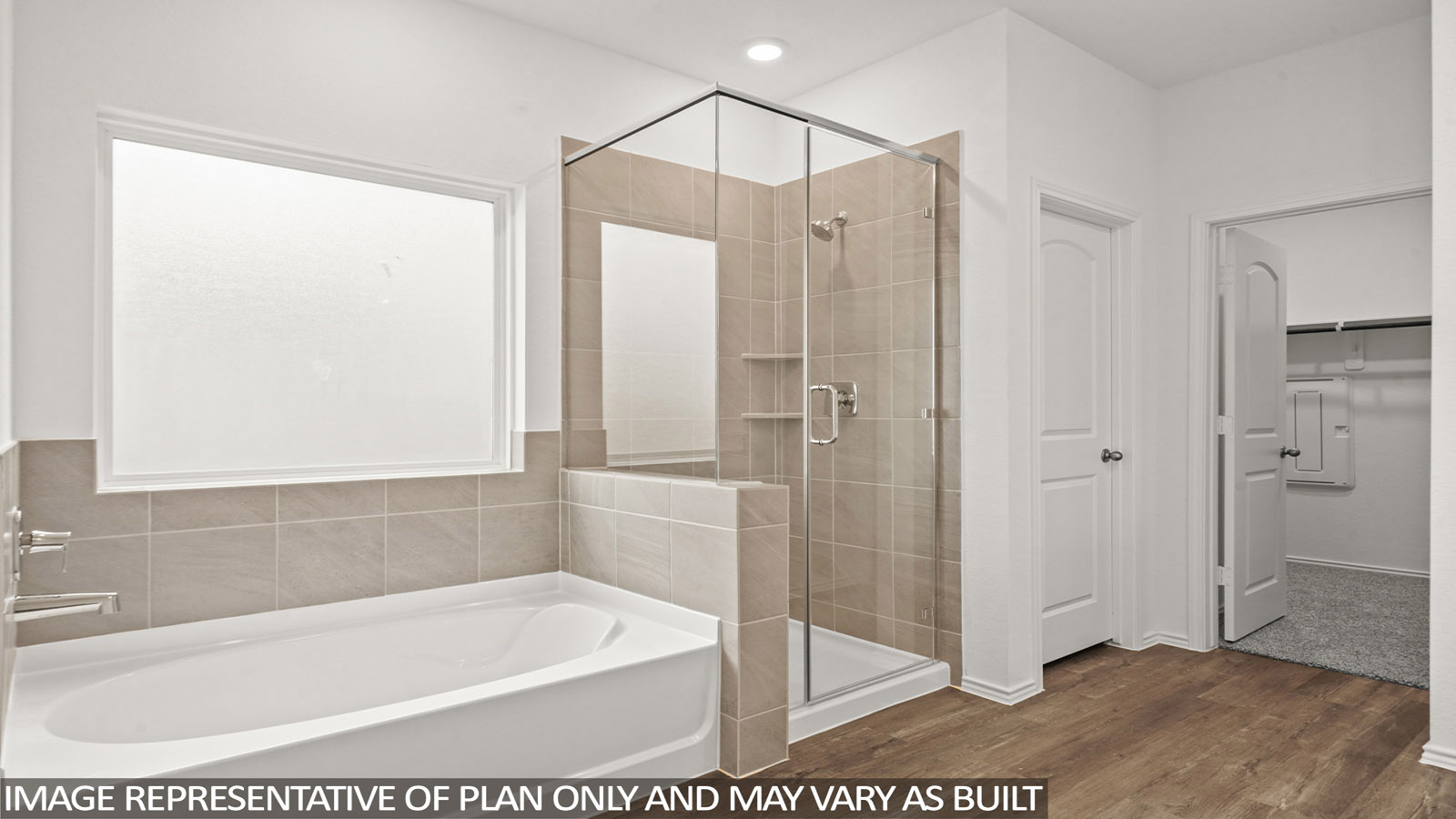 primary bathroom with separate tub and shower