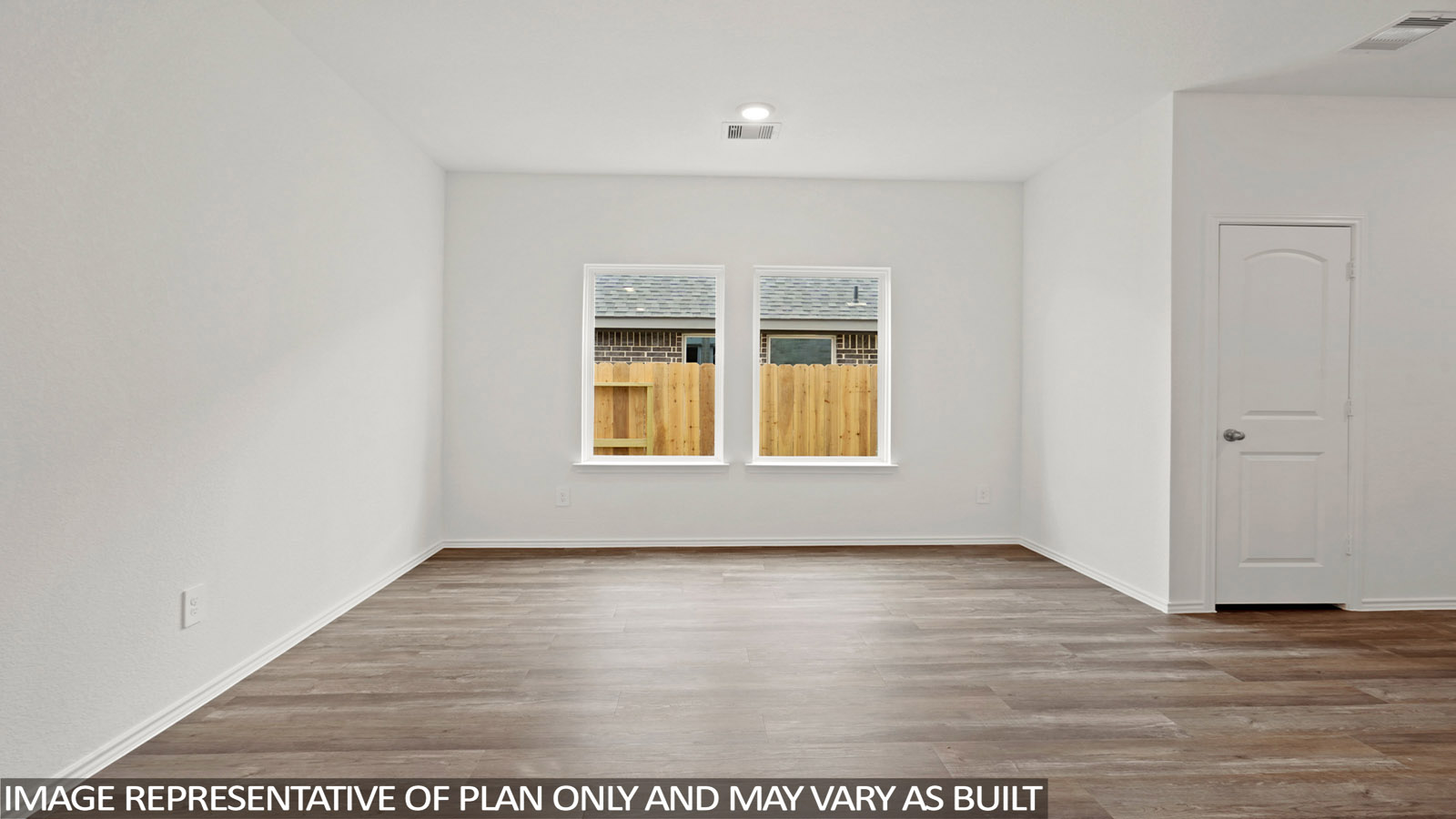 open concept living and dining area with vinyl flooring and large wwdo