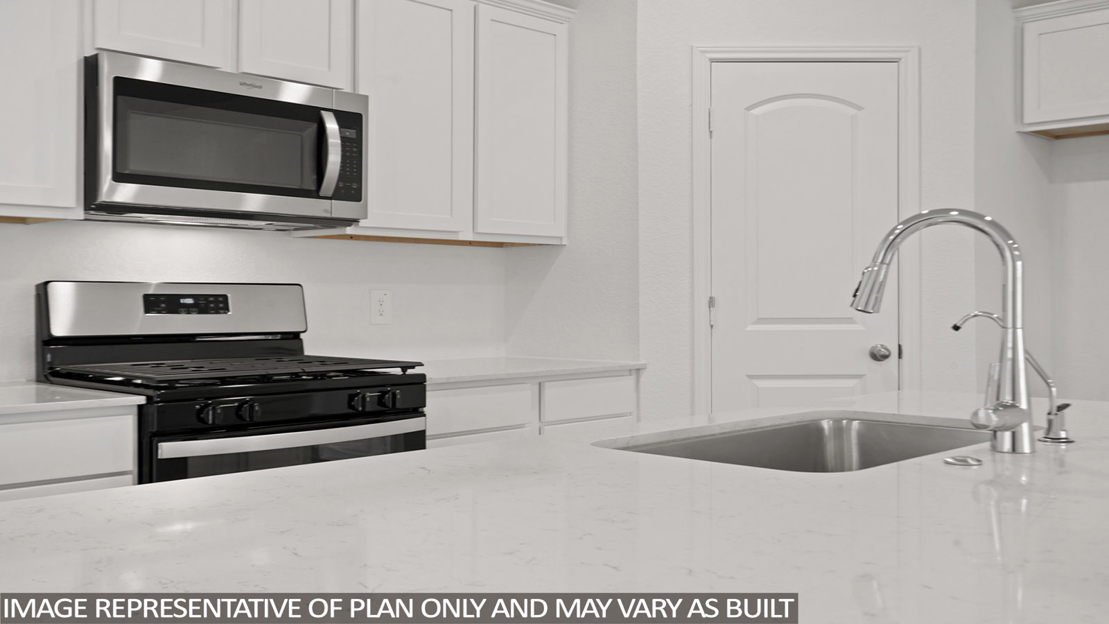 kitchen  th stainless steel appliances and quartz countertops