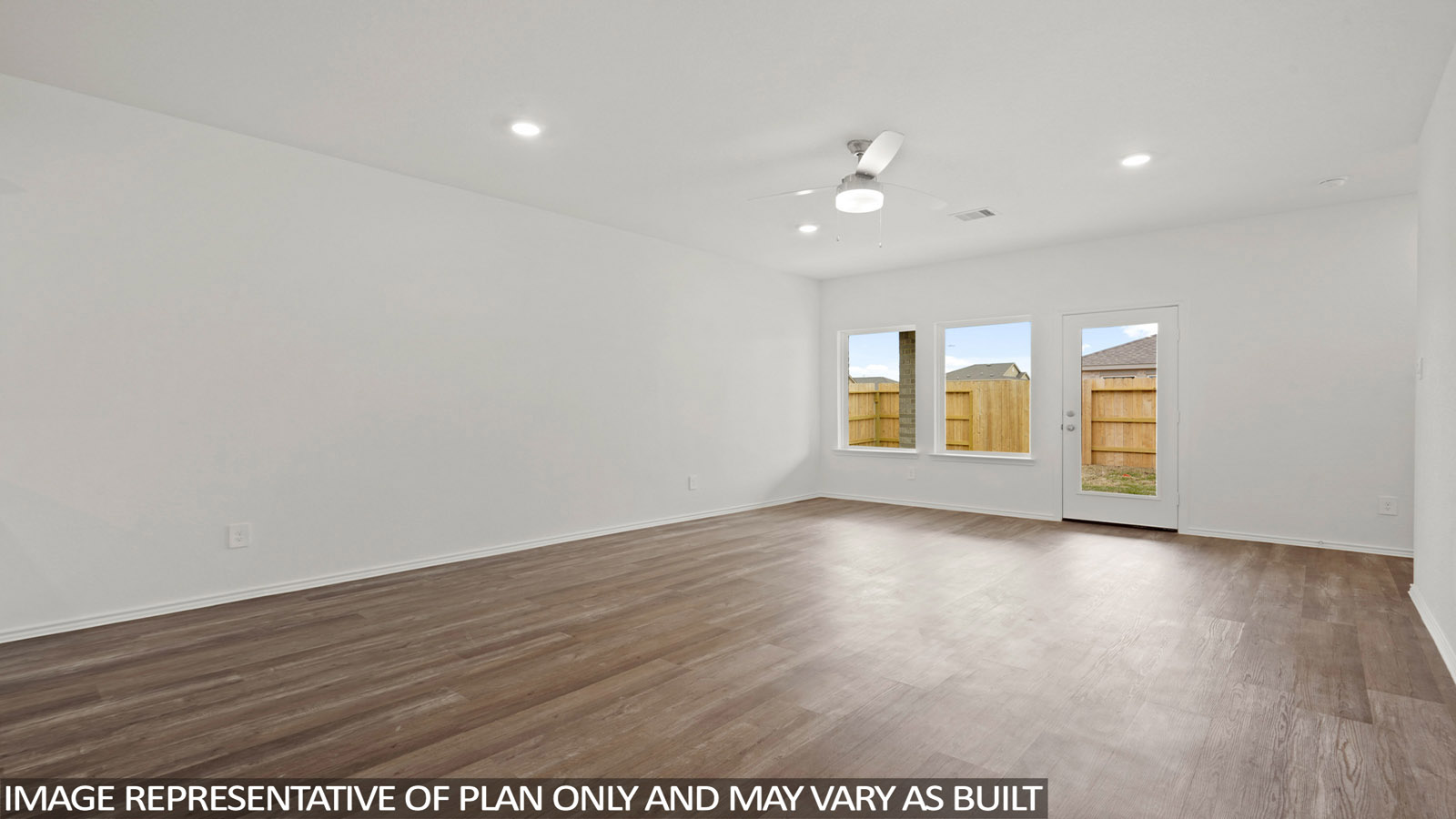 open concept living and dining area with vinyl flooring and large wwdo