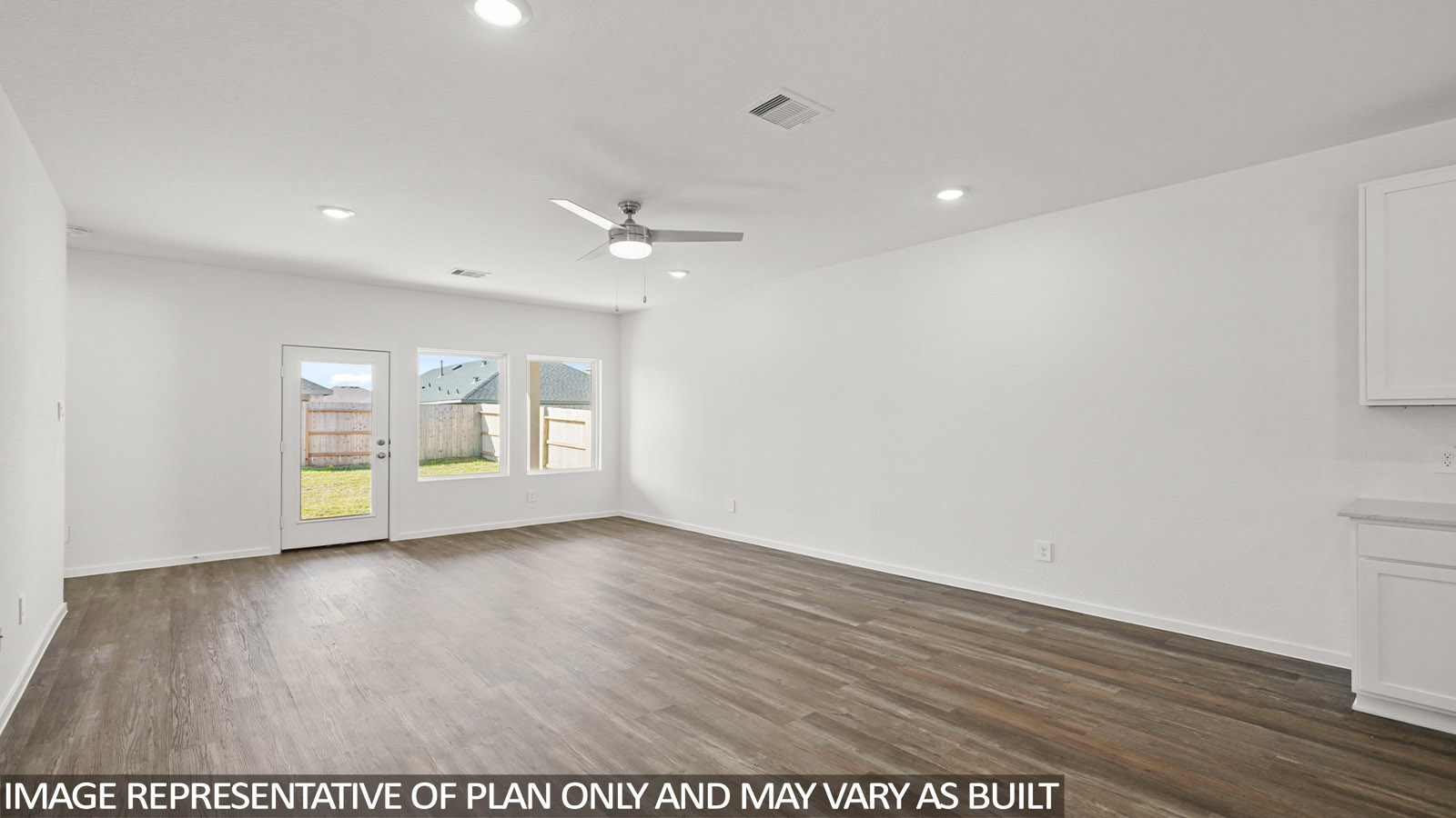 open concept living and dining area with vinyl flooring and large windows