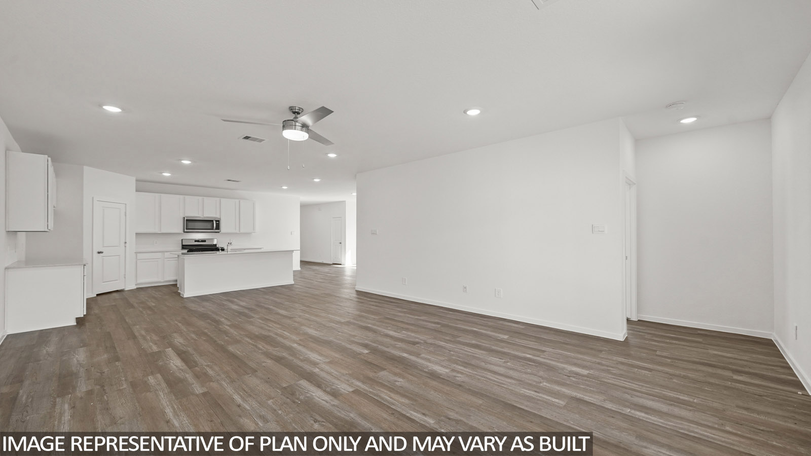 open concept living and dining area with vinyl flooring and large windows