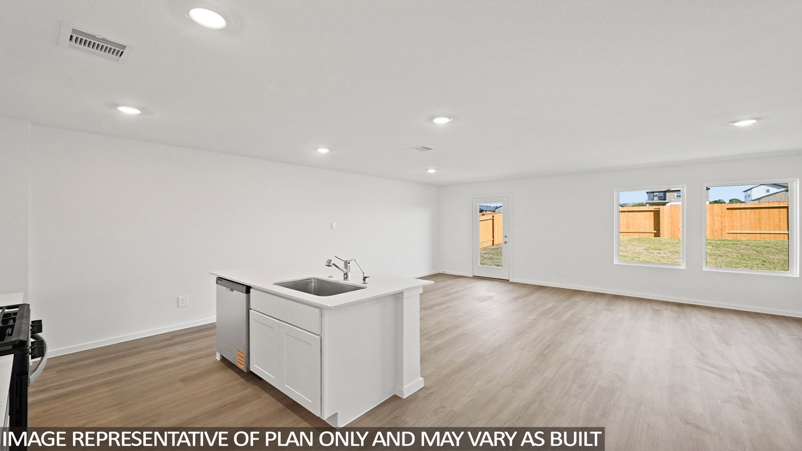 open concept living and dining area with vinyl flooring, quartz countertops, and large windows